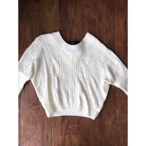 Cream, cropped sweater with black bow accent